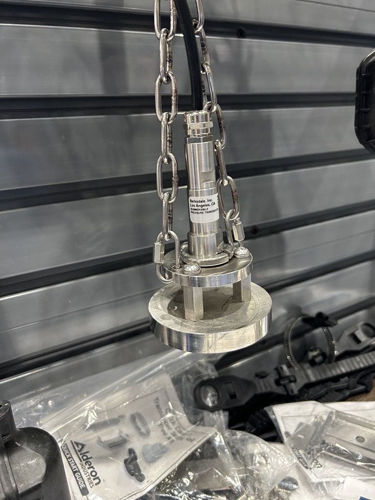 Barksdale submersible level transducer displayed with a protective-cage assembly at WEFTEC 2026.